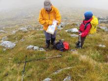 Man and son concluding a sampling process 